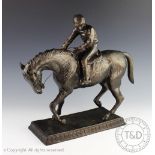 After Pierre-Jules Mene; a bronzed spelter figure modelled as a horse and jockey on a plinth base,