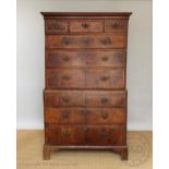 A George III and later walnut and feather banded chest on chest,