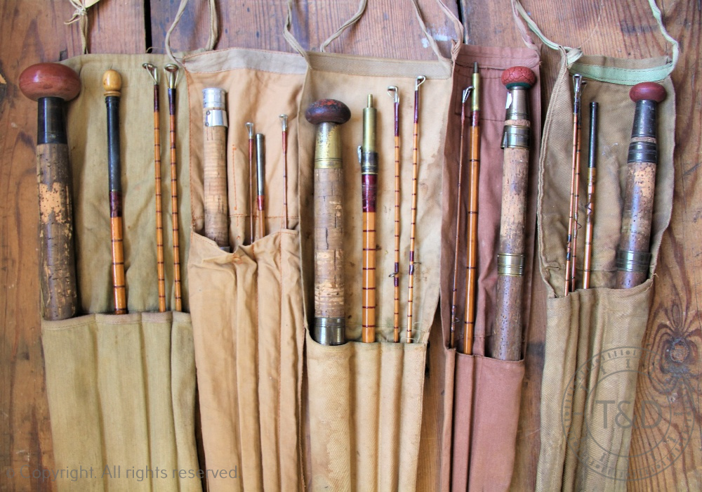 A collection of five vintage fishing rods,