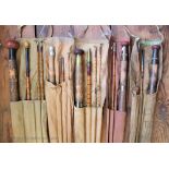 A collection of five vintage fishing rods,