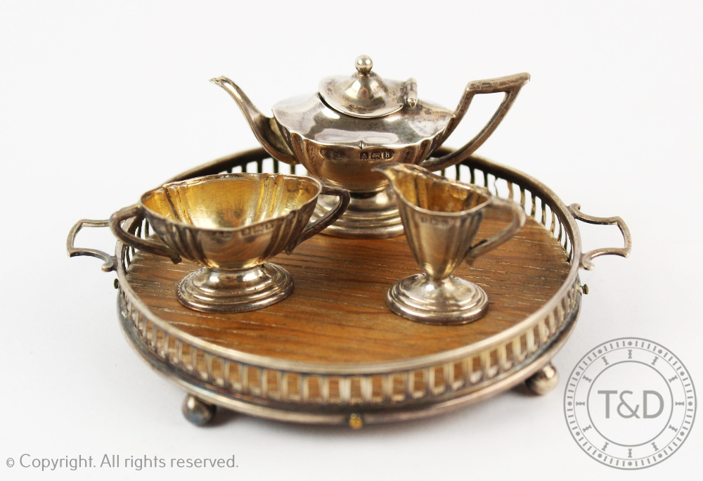 A miniature silver bachelors tea service and gallery tray, Levi & Salaman, Birmingham 1907/8,