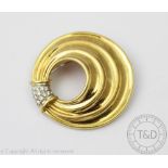 A diamond and 18ct gold brooch/pendant, the graduating circular brooch of abstract shell form,