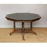 A Victorian ebonised walnut octagonal centre table in the manner of Lamb of Manchester,