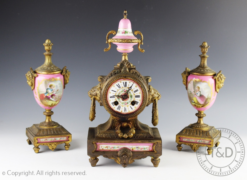 A 19th century French gilt metal and Sevres style porcelain mounted clock garniture,