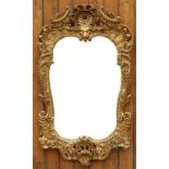 An early 19th century George II style gilt wood and gesso mirror - possibly Irish,