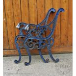 Two pairs of Coalbrookdale style cast iron bench ends, with lions head arms, on scroll legs,