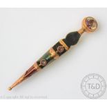 A Scottish hard stone set dirk form kilt pin, stamped 'WHL' '9ct',