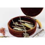A velvet covered casket containing an assorted collection of retractable propelling pencils,
