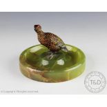 An early 20th century Austrian cold painted bronze model of a grouse, on onyx base,