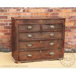 A late George III inlaid oak chest, with two short and three long drawers, lacking feet,
