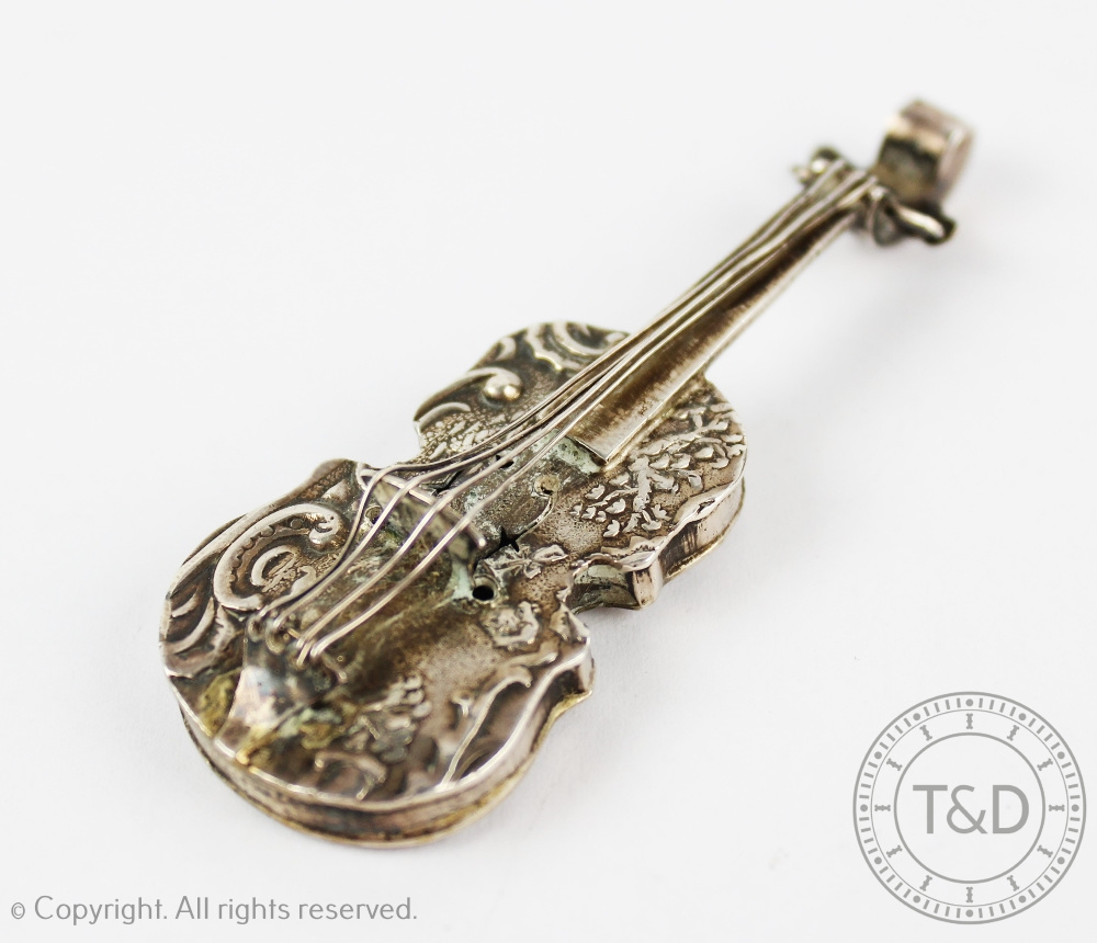 A continental silver miniature violin, bearing import mark for Theodore Hartman, London 1900, 7.