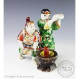 A Japanese figural group of bakers,
