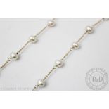 A delicate freshwater pearl necklace,