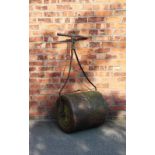 A vintage cast wrought iron lawn roller,