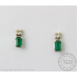 A pair of diamond and emerald earrings,