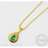 A diamond and emerald pear shaped pendant, designed as a central pear shaped, mixed cut emerald,