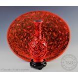 A large Cinnabar coloured lacquered bowl,