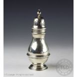 An Edwardian silver sugar caster, London 1903, of baluster form with reeded detail,