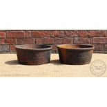 A pair of 19th century cast iron circular troughs 'The Ercall Feeding Pan',