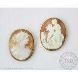 Two Victorian carved shell cameo brooches, one depicting cupid,