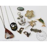 A collection of jewellery to include a Victorian anchor brooch, a pietra dura pansy panel,