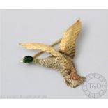 A gold and enamelled bird of prey brooch, 'JG & S' Birmingham,