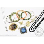 Assorted jewellery, to include; two jade coloured bangles, a faceted, marbled bangle,