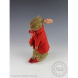 An early Beatrix Pottery Peter Rabbit soft toy, Steiff type, with amber coloured eyes,