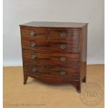 A late George III mahogany bow front chest, of two short and three graduated long drawers,