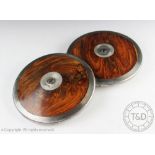 Two vintage discus, each 1.500kg disc with wooden and bound mounts, 20.