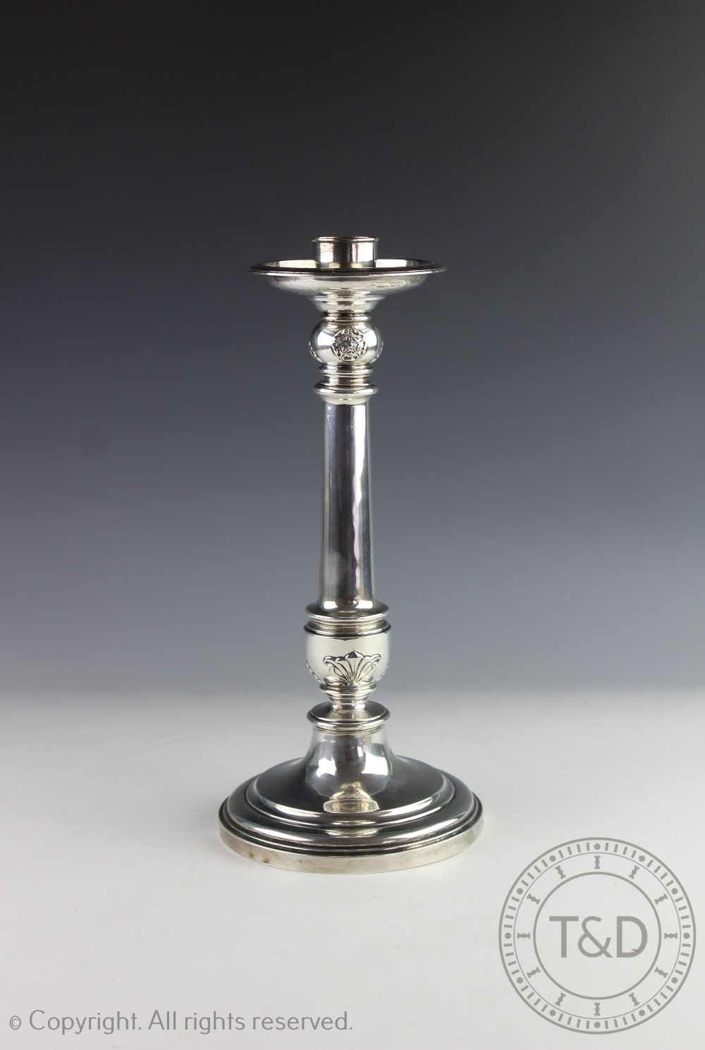 A silver candlestick Elkington and Co, Birmingham 1923, of baluster form,