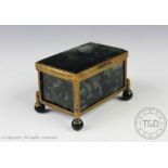 A 19th century moss agate casket, with hinged cover and set to each side with an agate plaque,