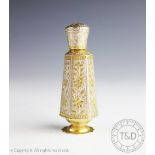 A white metal and parcel gilt eastern scent bottle,
