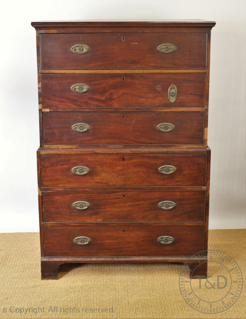 A George III mahogany chest on chest, with three long drawers above three long drawers,