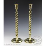 A large pair of Dutch style barley twist candlesticks, on circular bases, 45.