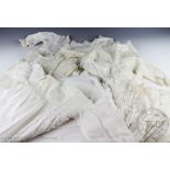 Four late Victorian / Edwardian white work and lace christening gowns, longest 97cm,