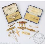 A collection of Victorian and later gold and silver brooches and stick pins to include a fox mask