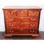 A George III mahogany chest, with three short and three long drawers, on ogee bracket feet,