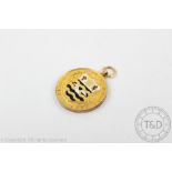 Motoring Interest: An enamelled 9ct yellow gold fob, Birmingham 1925,