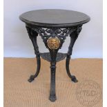 A cast iron pub / garden table 'The Viking', with circular stained wood top, 72.