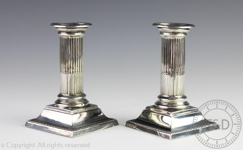 A pair of George V silver dwarf candlesticks, Hawksworth Eyre & Co, Sheffield 1929,