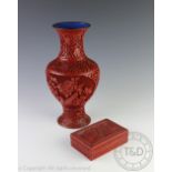A large Chinese Cinnibar coloured lacquered vase, of baluster shape,