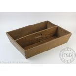 A late 19th century pine two division cutlery tray, with central handle,