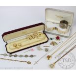 A collection of assorted jewellery, to include; a bangle, a coin set bracelet,