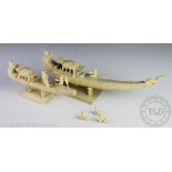A Chinese ivory tusk carving of a model junk, 19th century,
