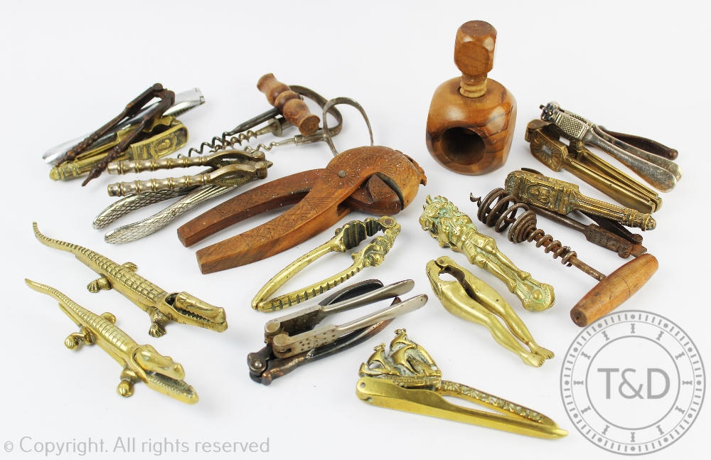 A collection of 19th century and later nut crackers and corkscrews including novel examples,