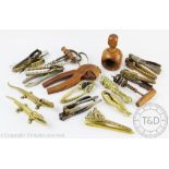 A collection of 19th century and later nut crackers and corkscrews including novel examples,