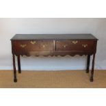 A George III and later oak dresser, with two drawers, on turned and block legs,
