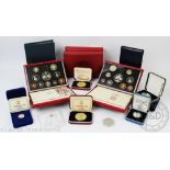 A selection of cased and loose proof coins and medallions,