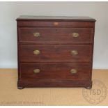 A Regency mahogany secretaire chest, the upper drawer with fall front enclosing a fitted interior,